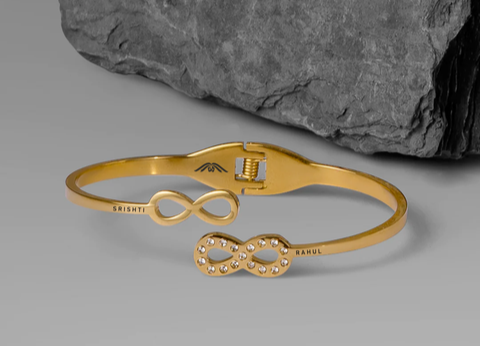 Gold bracelet product flat lay on white background